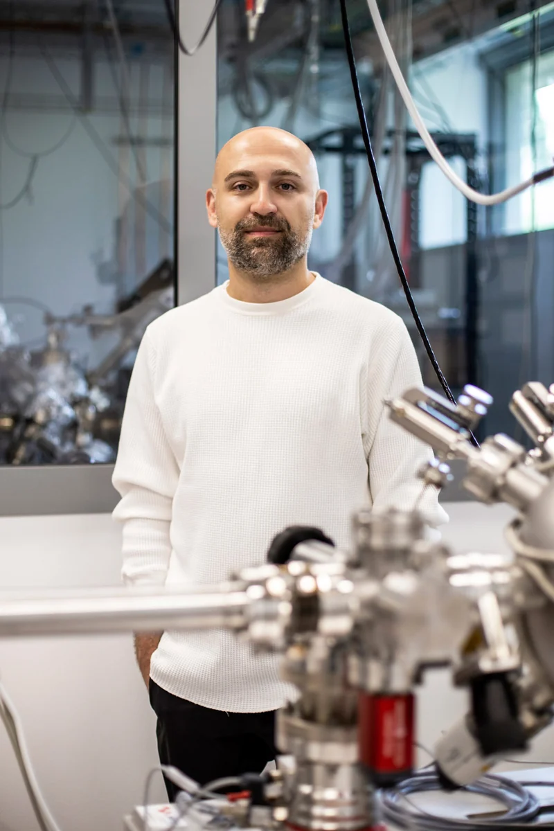 Artist Hrvoje Hiršl beside an optical laboratory setup